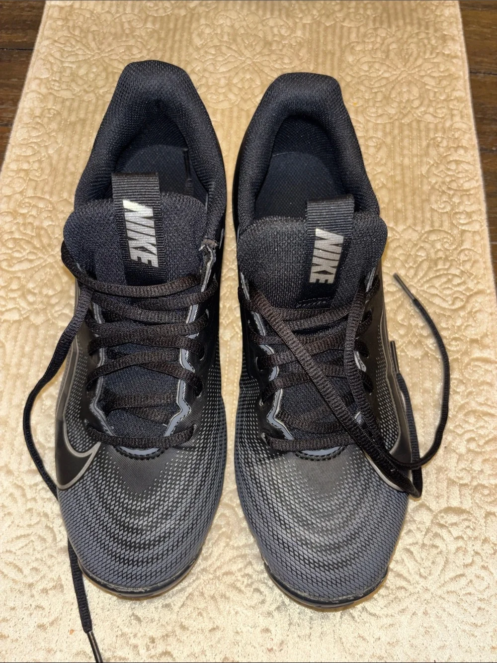 Youth Nike Black and Gray Football Cleats with Silver Swoosh